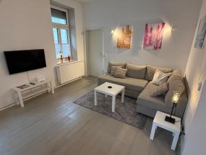 Телевизор и/или развлекательный центр в Schmuckstück an der Wormser Stadtmauer