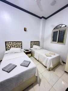 Ένα ή περισσότερα κρεβάτια σε δωμάτιο στο Masel guesthouse