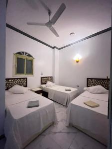 Ένα ή περισσότερα κρεβάτια σε δωμάτιο στο Masel guesthouse