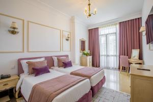 Postel nebo postele na pokoji v ubytování Majestic Hotel + 76 fotografií