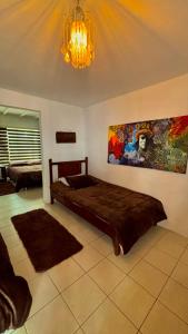 Un pat sau paturi într-o cameră la Hotel Las Tres Viejas