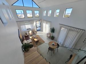 an overhead view of a living room with a table at Yzer Heights Relaxed Luxury Stay in Yzerfontein