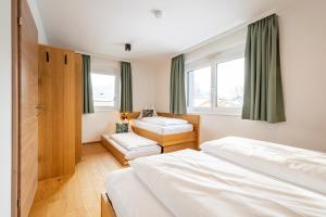 Giường trong phòng chung tại LISAL Appartements