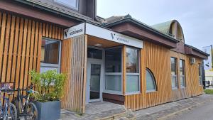 a building with bikes parked outside of it at Hostel Veronika Celje in Celje