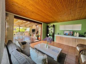 a living room with a couch and a table at Princess Holiday Home in Cape Town