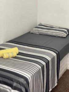 Ένα ή περισσότερα κρεβάτια σε δωμάτιο στο Da Praia Hotel +7 φωτογραφίες