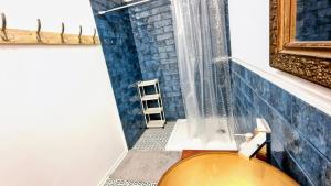 a bathroom with a toilet and a window at Orientarium Atlas Arena Family House in Łódź +29 photos