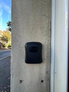 a black box on the side of a wall at Le petit cocon in Sens