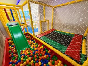a play room filled with lots of balls at Pousada Duas Ilhas in Penha