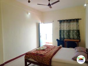 a bedroom with a bed and a window at Oasis Arambol in Arambol +29 photos