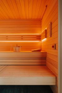 a sauna with wooden walls and a wooden ceiling at The Cyrus Hotel in Wrocław