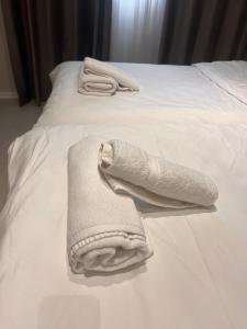 En eller flere senge i et værelse på TEN residences