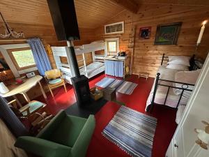 an overhead view of a bedroom and living room in a log cabin at Forestry cabin and sauna cabin in Halmevaara