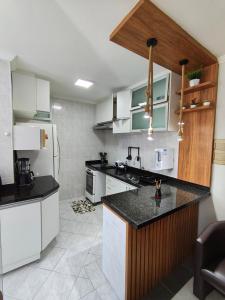 Фотография из галереи Apartamento completo perto da praia do Sesc Bertioga в городе Бертиога