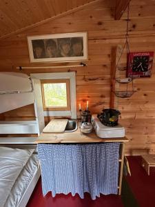 a room with a counter with a sink in a cabin at Forestry cabin and sauna cabin in Halmevaara