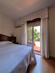 Postel nebo postele na pokoji v ubytování Hotel Anabel Baza