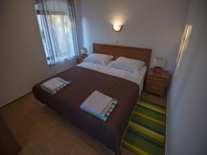 Ein Bett oder Betten in einem Zimmer der Unterkunft Apartments Punta