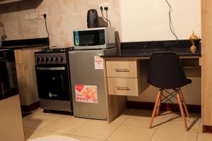 Η κουζίνα ή μικρή κουζίνα στο Munawar Homes +1 φωτογραφίες