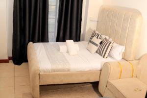 Ένα ή περισσότερα κρεβάτια σε δωμάτιο στο Munawar Homes