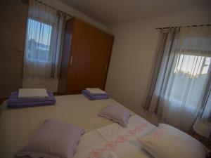 Ein Bett oder Betten in einem Zimmer der Unterkunft Apartments Punta