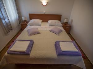 Ein Bett oder Betten in einem Zimmer der Unterkunft Apartments Punta