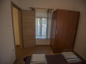 Ein Bett oder Betten in einem Zimmer der Unterkunft Apartments Punta