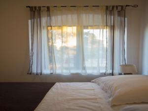 Ein Bett oder Betten in einem Zimmer der Unterkunft Apartments Punta