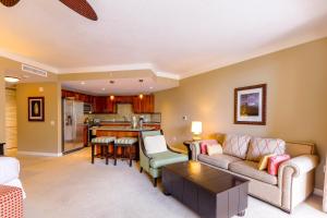 a living room with a couch and a table at Honua Kai H237 in Kaanapali Airport