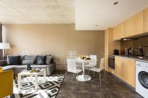 a living room with a couch and a table at Aveiro Urban Apartment by Visit-Aveiro in Aveiro +12 photos