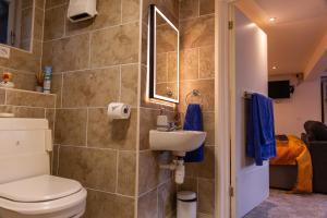 a bathroom with a toilet and a sink at 1 Bedroom studio with free parking in Truro +20 photos