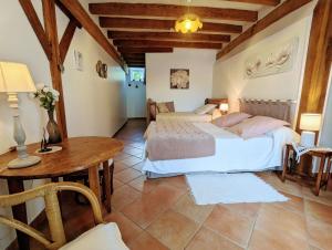 Giường trong phòng chung tại La Tuilerie, Chambre n° 2