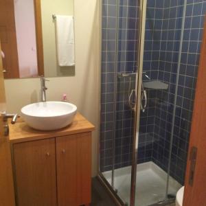 a bathroom with a sink and a shower with a sink at Casa do Villas in Castelo de Paiva +19 photos