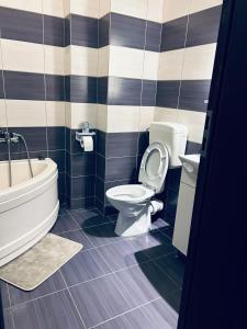 Koupelna v ubytování Bella Home Apartment