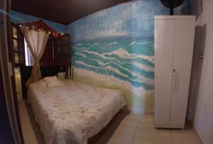 Giường trong phòng chung tại Casa por día na Praia - Tucuns