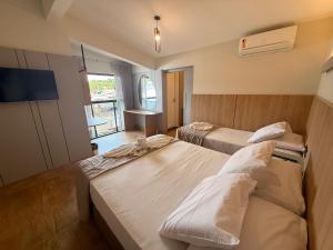 Кровать или кровати в номере Pousada Duas Ilhas +20 фотографий