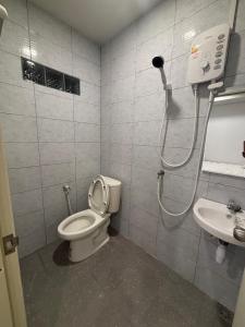 a bathroom with a shower and a toilet and a sink at Mong Do Lay Baan Sea View in Ban Ao Makham