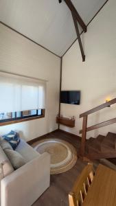 TV a/nebo společenská místnost v ubytování Morada dos Butiás