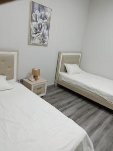 Postel nebo postele na pokoji v ubytování 2 bedrooms Lusail apartment