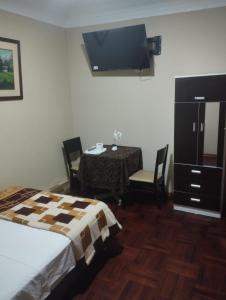 Postel nebo postele na pokoji v ubytování Hospedaje el señorial