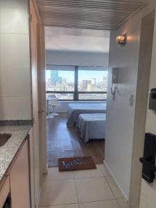 En eller flere senge i et værelse på Hermoso Estudio en el corazón de Buenos Aires