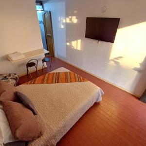 Ένα ή περισσότερα κρεβάτια σε δωμάτιο στο El Mejor Aparta Estudio De La Ciudad