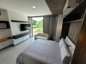 En eller flere senge i et værelse på Cali 2-02 Pance Apto sector exclusivo + 5 billeder