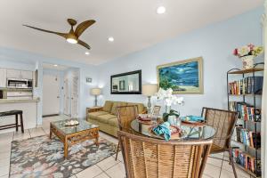 a living room with a couch and a table at Hono Kai A4 in Wailuku +26 photos