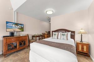 Ένα ή περισσότερα κρεβάτια σε δωμάτιο στο Kihei Bay Surf 245