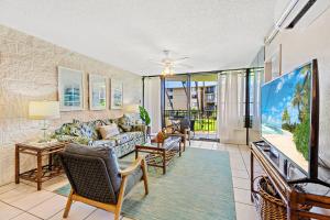 a living room with a couch and chairs at Kanai A Nalu 214 in Maalaea