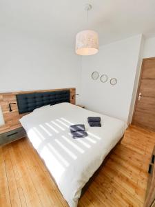 Postel nebo postele na pokoji v ubytování Les Sardines