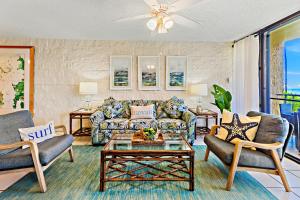 a living room with a couch and chairs and a table at Kanai A Nalu 214 in Maalaea +30 photos