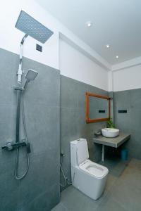 a bathroom with a shower and a toilet and a sink at Villa Balcony Bliss in Unawatuna +56 photos