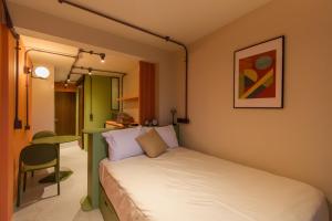 Postel nebo postele na pokoji v ubytování Nico Hotel & Residences