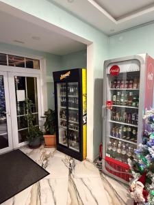 a cocacola soda machine in a store at Bernotiškių Hotel & Dining 